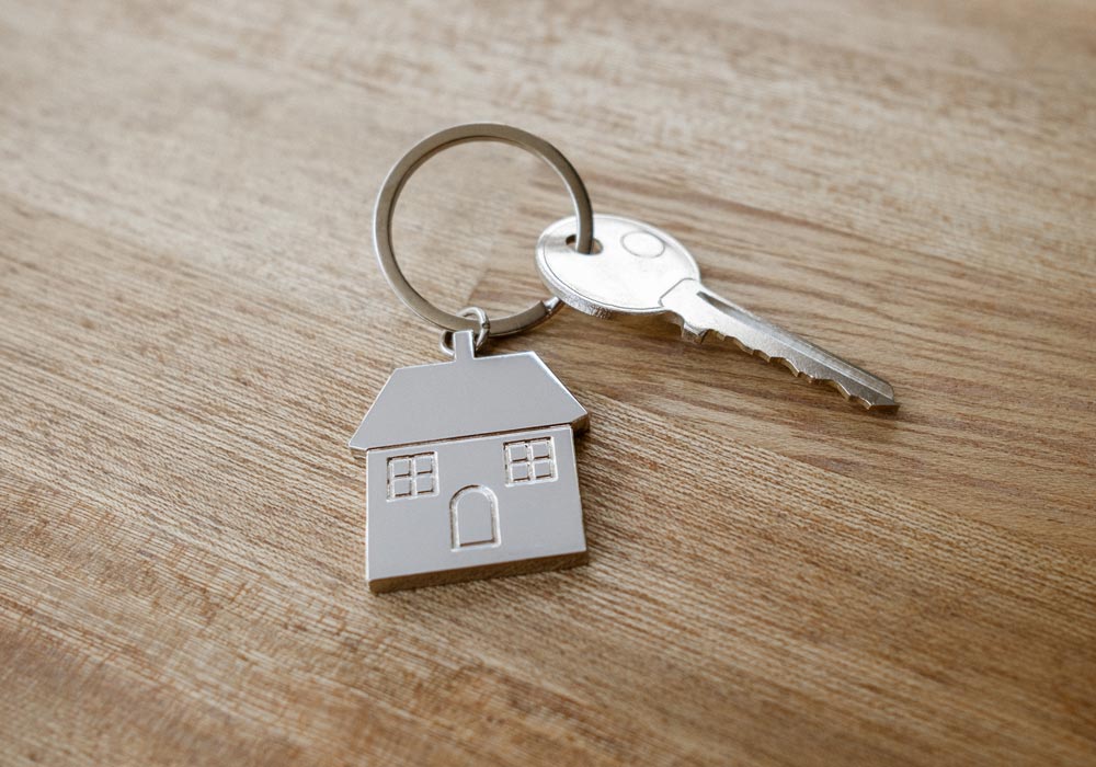 Keyring with key and silver house
